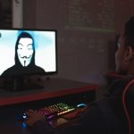 Man in black hoodie having a video call