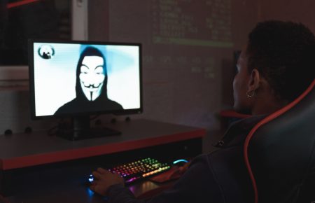 Man in black hoodie having a video call